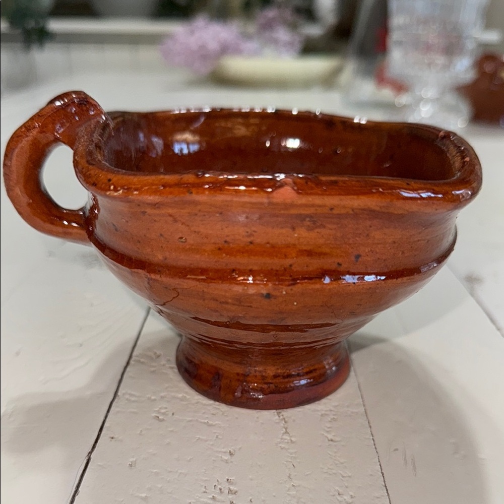 The object is a type of ceramic cooking pot called a cazuela earthenware Latin